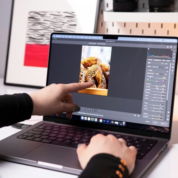 A person sitting in front of a laptop computer